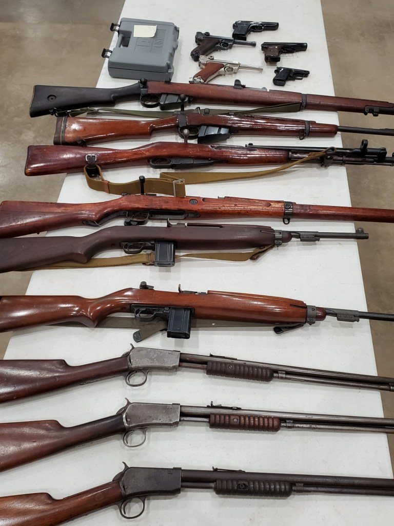 Firearms displayed for an Asset Marketing Pros online auction